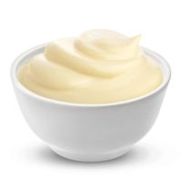 Mayonnaise sauce in bowl isolated on white background with clipping path. One of the collection of various sauces